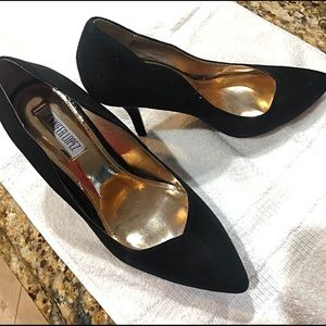 Black satin pumps